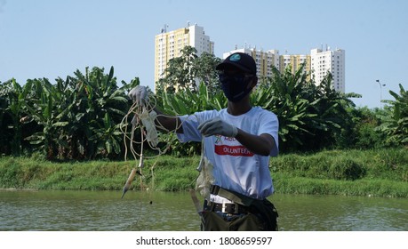 Tangerang / Indonesia -4 September 2020 - Covid-19 Task Force Officers Together With Environmental Activists Found Medical Waste Suspected To Be COvid-19 Waste In The Cisadane River