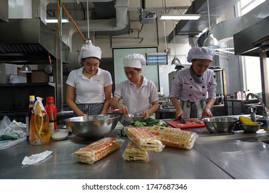 Tangerang, Indonesia - August 29, 2016 - Students Majoring In Hospitality Management At The Pelita Harapan Tourism College While Studying Cooking Practices.