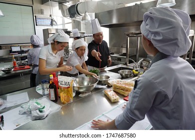 Tangerang, Indonesia - August 29, 2016 - Students Majoring In Hospitality Management At The Pelita Harapan Tourism College While Studying Cooking Practices.