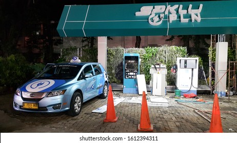 Tangerang, Indonesia - January 11 2020: China Electric Car BYD E6 Used By Blue Bird As An Electric Taxi Fleet, Is Charging At New Build Station In Tangcity Mall