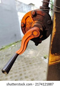 Tangerang, Indonesia. July 2 2022: Close Up Dirty Crank Pump That Is Wired To A Block Of Wood