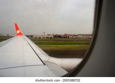 Tangerang, Indonesia - May 22, 2021: View Of Soekarno Hatta Airport That Seen From The Lion Air Plane Window.