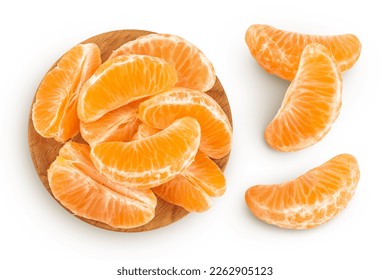 Tangerine or clementine slices in wooden bowl isolated on white background with full depth of field. Top view. Flat lay