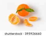 tangerine with separated segments on white background