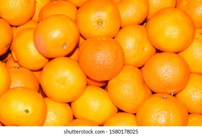 Tangerines on a white background with sweets
