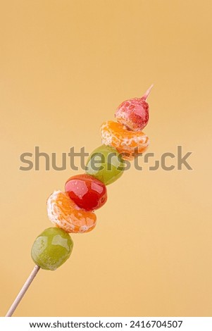 Tanghulu, a fruit skewer Korean snack candy coated with sugar syrup