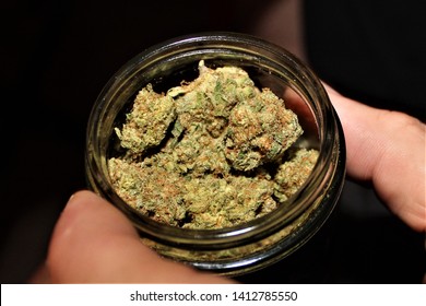 Tangie Nugs Of Cannabis In A Glass Container Black Market Arizona Usa