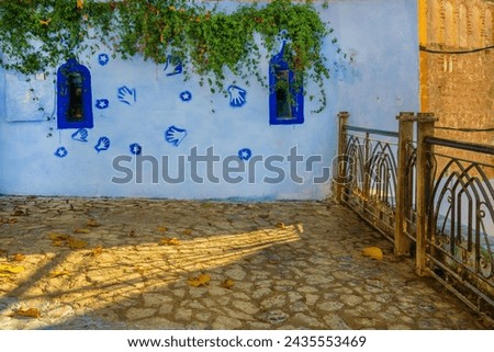 Tangier and Chefchaouen Morocco travel photographs of various village scenes depicting stairs artwork city scapes golden hour blue hour sunset sunrise the blue city with blue painted walls hearts