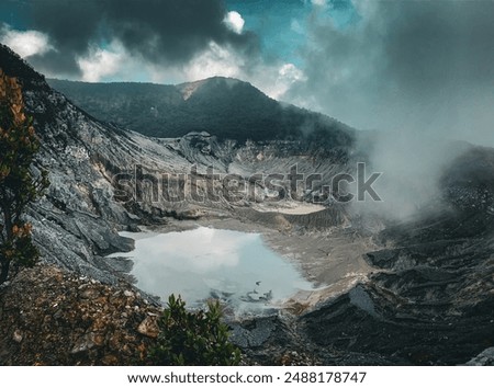 TANGKUBAN PERAHU, WEST JAVA, INDONESIA, 27 DECEMBER 2023 - View of a mountain with a crater and fog