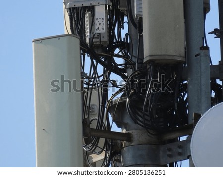 A tangle of cables on a telecommunications tower