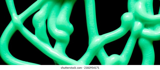 Tangle Of Stream Of Liquid Silicone On A Black Background