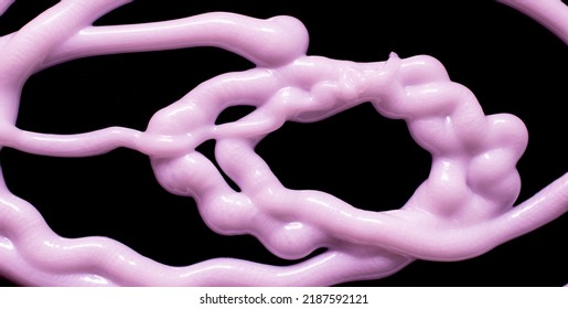 Tangle Of Stream Of Liquid Silicone On A Black Background