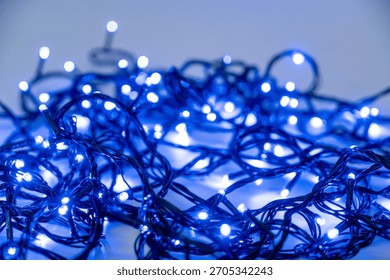 Tangled blue LED string lights creating a mesmerizing glow.