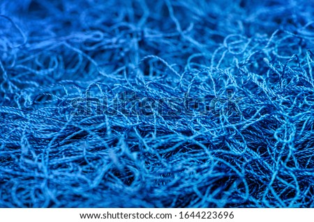Tangled blue threads. Selective focus.