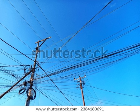 Tangled cables with blue skies background