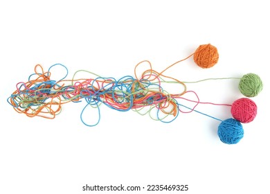 Tangled colorful cotton threads and balls isolated on white background. Abstract thread lines chaos pattern.