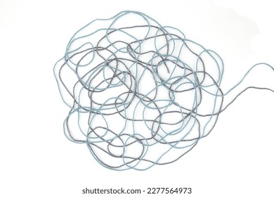 Tangled colorful cotton threads isolated on white background. Abstract thread lines chaos pattern.