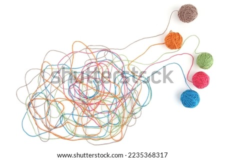 Tangled colorful cotton threads isolated on white background. Abstract thread lines chaos pattern.