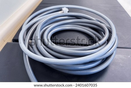 tangled electrical cords, a chaotic and complex network, symbolizing connection and technological mess