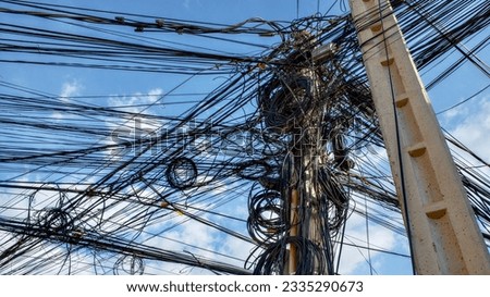 Tangled electrical wires, chaos in the city's power supply system.