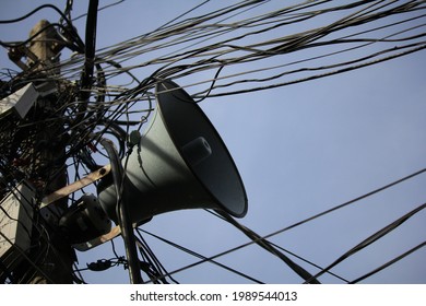 Tangled Electrical Wires, Telephone Cables And Loudspeaker Pole