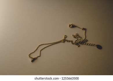 Tangled Necklace Beige Background