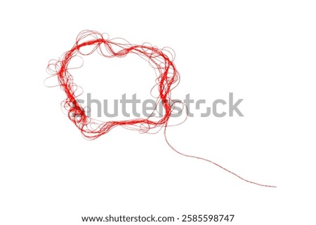 Tangled red thread on white background