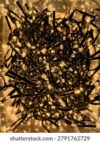 Tangled string lights glowing with warm light, creating a decorative and festive atmosphere