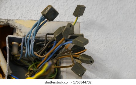 Tangled wires of a wall socket