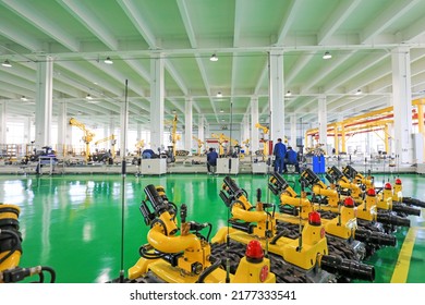 Tangshan, China - December 16, 2021: Workers Work Hard On The Fire Robot Production Line, North China

