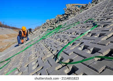 Tangshan, China - December 24, 2021:Workers Are Building River Slope Protection At A Water Conservancy Project Construction Site, North China