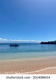 Tangsi Beach At Eastern Lombok Peninsula, More Popular As Pink Beach. Visible From The Distance Is The Ever Famous Mount Rinjani.