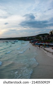 Tanjung Bira Beach South Sulawesi Indonesia - March 27, 2022. Beautiful view of sandy beach with tourists swimming in beautiful clear seawater, Tanjung Bira Beach South Sulawesi Indonesia.