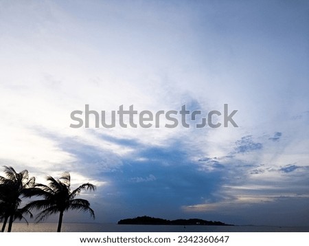 Tanjungpinang, Indonesia – January 5, 2023: A view of sunset in seaside in the evening in Tanjungpinang, Indonesia on January 5, 2023.