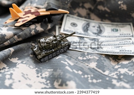 tank against the background of dollars. Concept of war.