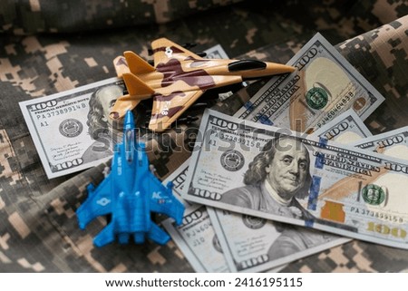 tank against the background of dollars. Concept of war.