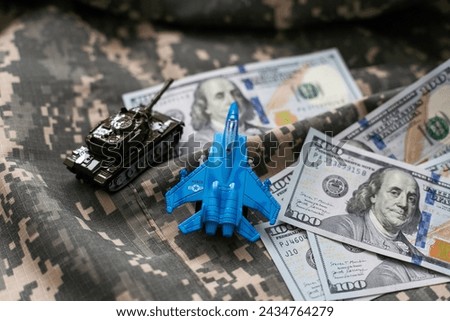 tank against the background of dollars. Concept of war.