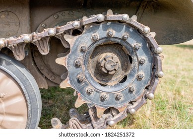 Tank caterpillar tread (continuous track) with drive sprocket wheel close up