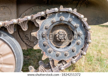 Tank caterpillar tread (continuous track) with drive sprocket wheel close up