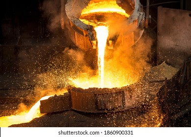 Tank pours liquid metal at the steel mill - Shutterstock ID 1860900331