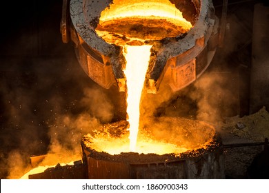 Tank pours liquid metal at the steel mill - Shutterstock ID 1860900343