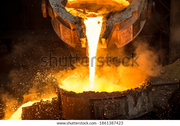 Tank pours liquid\
metal at the steel mill
