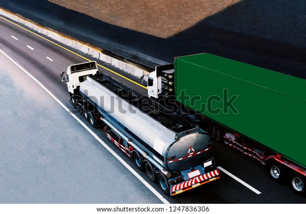 Tank Truck\
Gas or oil and Truck with green container on highway road,\
transportation concept.,import,export logistic industrial\
Transporting Land transport on the\
expressway