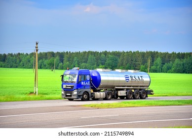 Tank truck MAN driving on highway. B.S.A.T. specifics of the truck transportation of liquid goods. Metal chrome cistern tanker with petrochemicals products. Oil and Gas. Russia, Smolensk, JUN 20, 2021
