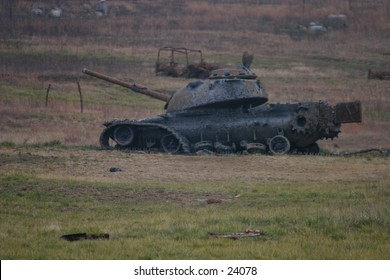 tank wreck in field