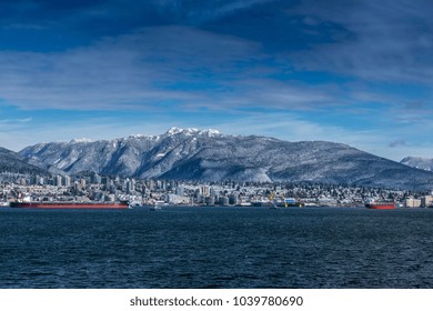 Tanker And Rocky Mountains, North Vancouver, British Colombia, Canada.
