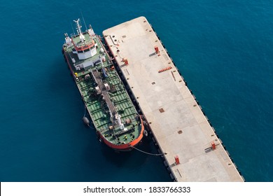 Tanker Ship With Green Deck Is Moored In Port, Aerial View