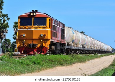 Tanker Train By Diesel Locomotive On Railway