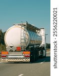 Tanker truck driving on sunny highway