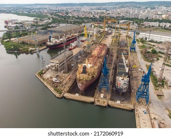 Tanker Vessel Repair In Dry Dock Shipyard, Aerial Top View